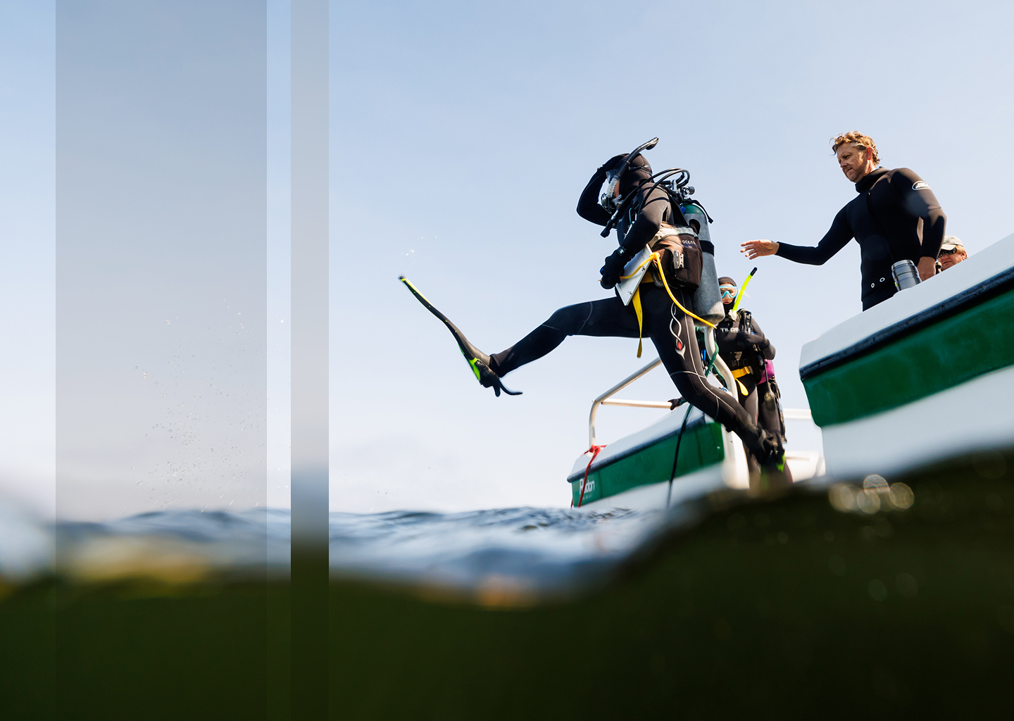Scuba diver jumping into the ocean