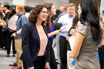 Students talking at a networking event